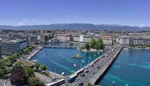 Aerial view of Geneva, Switzerland highlighting the city's architecture along the clear blue waters of Lake Geneva